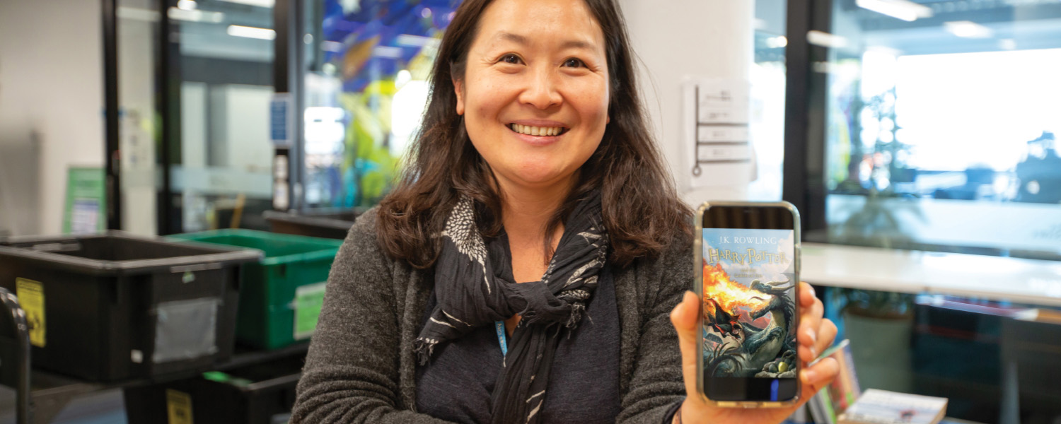 Library member uses the Tauranga City Libraries mobile app on a smartphone.