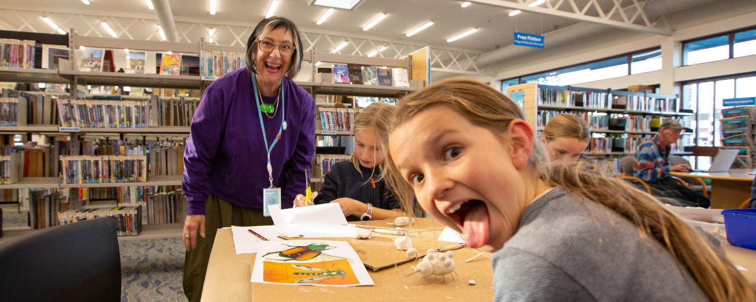 Children taking part in a library craft activity.
